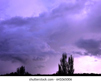 Dramatic sky with clouds above the forest. Abstract.