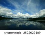 Dramatic sky with clouds over lake