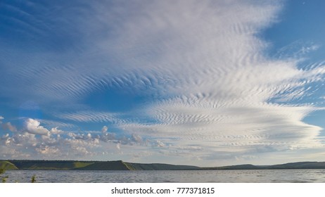 Dramatic sky with clouds pattern at lake.