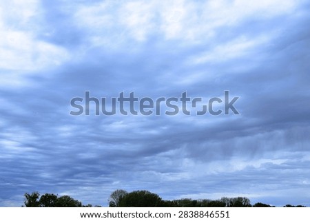 dramatic sky with clouds - rainy day - scenic nature - sturcture in the nature background 