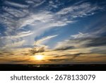 Dramatic sky and clouds at sunset over the coast of Hudson Bay, as a nature background
