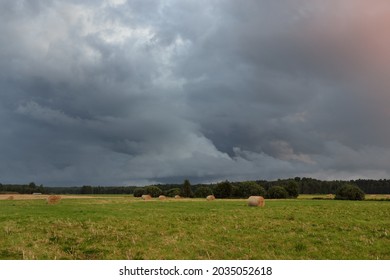 Dramatic Sky, Dark Clouds Above The Plowed Agricultural Field And Forest. Rural Scene. Atmospheric Landscape. Early Autumn. Nature, Fickle Weather, Ecology, Environment, Farm Industry, Remote Places