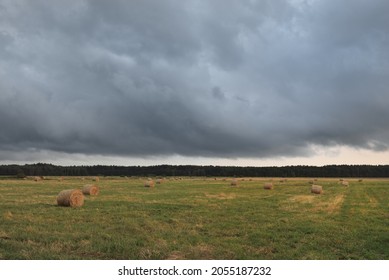 Dramatic Sky, Dark Clouds Above The Plowed Agricultural Field And Forest. Rural Scene. Atmospheric Landscape. Early Autumn. Nature, Fickle Weather, Ecology, Environment, Farm Industry, Remote Places