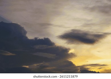 dramatic sky with dark clouds and sunset light
