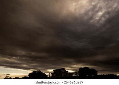 Dramatic sky with dark clouds at sunset