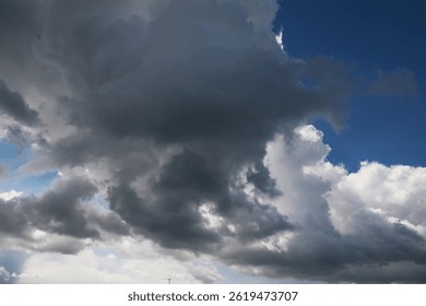 Dramatic Sky with Dark Storm Clouds and Sunlight Breaking Through