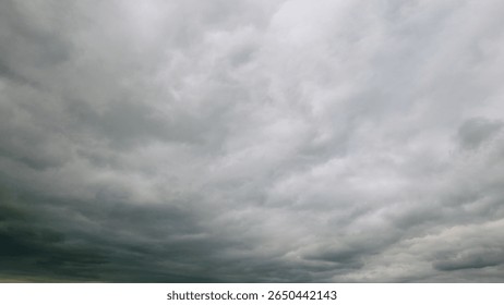 A Dramatic Sky Displaying Gray Clouds Was Beautifully Captured Overhead Above Us