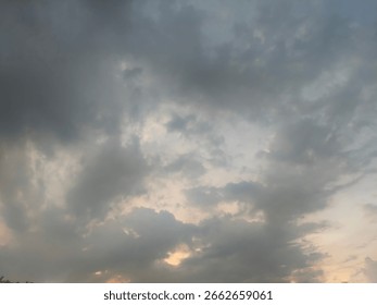 A dramatic sky filled with grey clouds creates a moody atmosphere, suggesting an approaching storm or the end of the day.