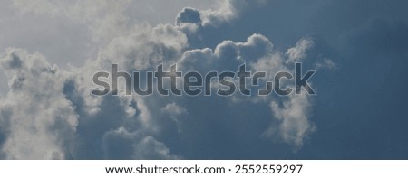 Dramatic sky filled with large, billowing clouds. Vibrant skyscape with majestic, soft, and fluffy clouds. Cloud texture Banner 