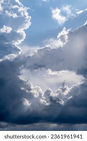 Dramatic sky with grey clouds over the city before the storm. Weather before or after a storm.