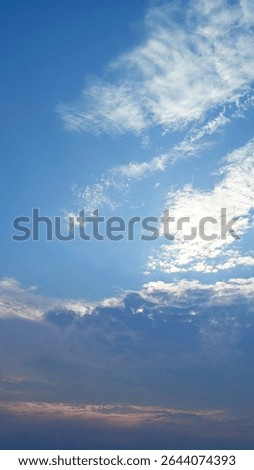 Dramatic sky with layers of white and dark. A beautiful natural gradient ideal for backgrounds, weather themes, or nature-related content.