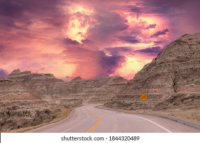 Dramatic Sky With Lightning Bolts On A Deserted, Winding Road In The Badlands National Park In South Dakota, United States, No People