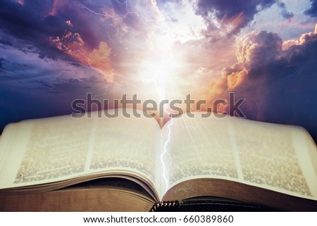 Dramatic sky with open Bible
