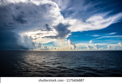 A Dramatic Sky Over An Open, Calm Ocean.