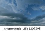 Dramatic sky. Sometimes heavy clouds mass charged. Dark stormy sky with gray cumulus rain clouds. Timelapse.