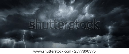 Dramatic sky with storm clouds before rain. Panoramic view of the stormy sky and dark clouds.  Concept on the theme of weather, natural disasters.