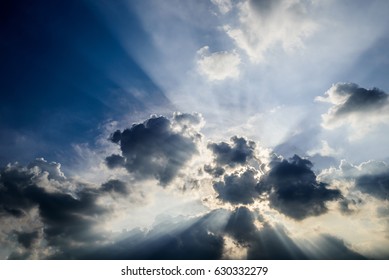 Dramatic sky, Sun ray shine with clouds in blue sky background