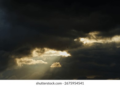 Dramatic Sky with The sun is shining through the clouds.