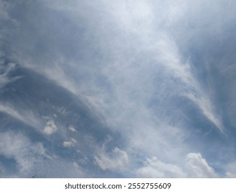 a dramatic sky with swirling clouds, perfect for use as a background or texture in digital art or design projects