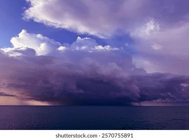 Dramatic sky thunderstorm clouds over ocean.