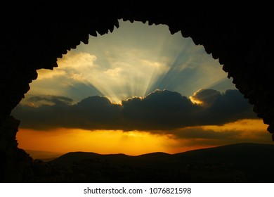 dramatic sky. view from an ancient arch in Israel on dramatic sky clouds