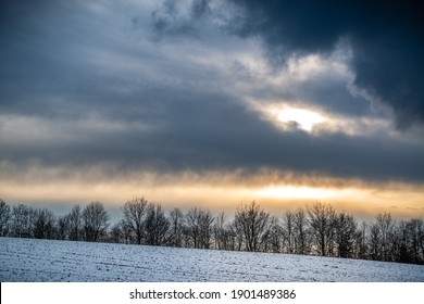 Dramatic sky winter landscape with sundown