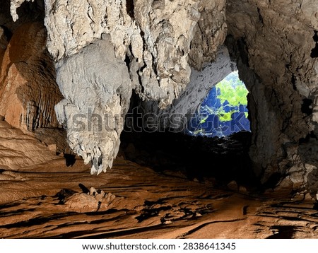 Dramatic skylit chambers deep inside Son Doong Cave during a trekking expedition in Phong Nha-Ke Bang National Park, Vietnam