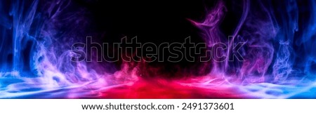 Dramatic smoke and fog effect in intense red, blue, and purple colors. Vivid and intense abstract background or wallpaper.