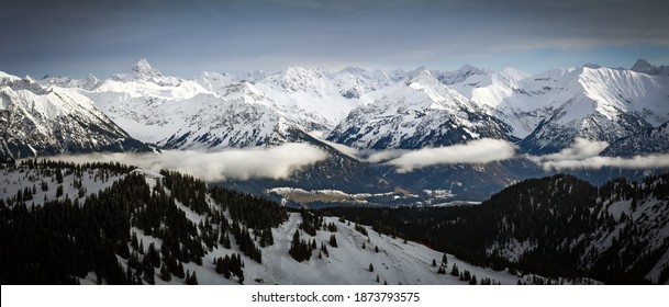 Dramatic Snow Covered Mountains Landscape. Amazing Panoramic Snowy Winter Landscape In Alps At Sunrise Morning. View From Riedberger Horn Grasgehren Ski Resort To Allgau Alps, Bavaria, Germany.