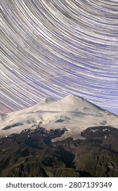 Dramatic star trail composition captures the rotation of the night sky above Cotopaxi, Ecuador's second-highest volcano.