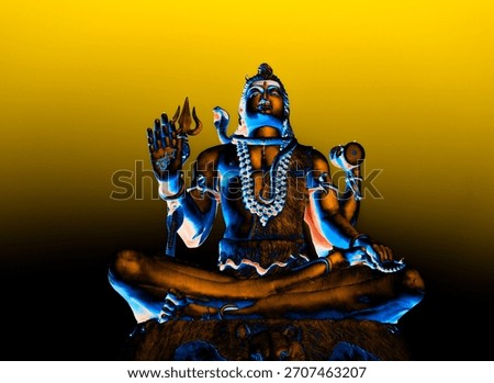 dramatic statue of hindu almighty lord shiva with colorful lights
