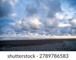 Dramatic Storm Clouds Above Tropical Black Sand Beach