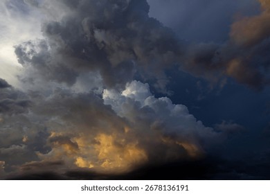 Dramatic storm clouds before a thunder-storm at sunset.