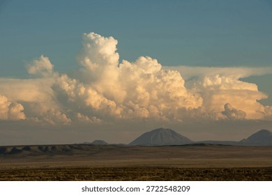 Dramatic storm clouds bring thunder and lightning in a New Mexico desert landscape