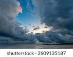 Dramatic storm clouds build up on the North Sea coast over the North Frisian island of Föhr