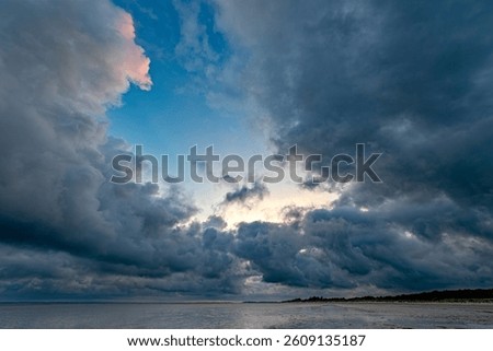 Dramatic storm clouds build up on the North Sea coast over the North Frisian island of Föhr