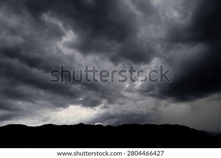 dramatic storm clouds in the dark