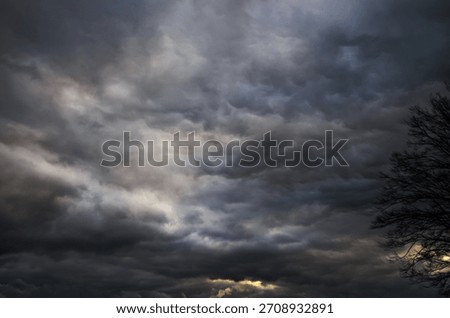 Dramatic storm clouds fill the sky with a sense of foreboding