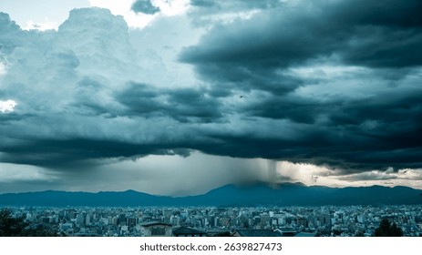 Dramatic storm clouds loom over a cityscape with distant mountains, creating a striking contrast between urban life and nature.