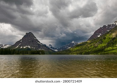 Dramatic Storm Clouds Over East Glacier Mountains and Lake, Glacier National Park, Montana – Moody June Wilderness Landscape