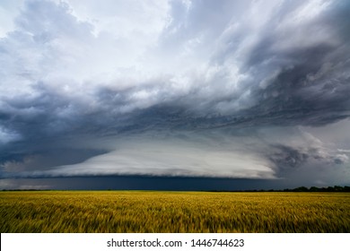 Dramatic storm clouds over a farm field