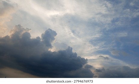 Dramatic storm clouds and soft sunlight create a breathtaking sky landscape. Perfect for nature, weather, cloudscape, atmospheric, and background photography collections.