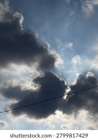 Dramatic Storm Clouds with Sun Rays Breaking Through the Sky
