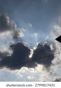 Dramatic Storm Clouds with Sun Rays Breaking Through the Sky