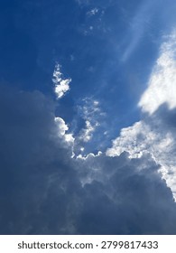 Dramatic Storm Clouds with Sun Rays Breaking Through the Sky