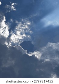 Dramatic Storm Clouds with Sun Rays Breaking Through the Sky