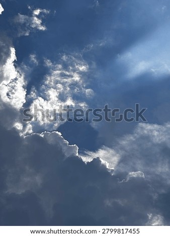 Dramatic Storm Clouds with Sun Rays Breaking Through the Sky