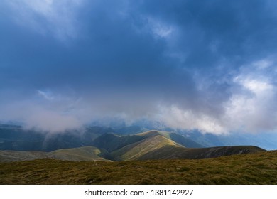 Dramatic storm clouds at sunset, in the Alps in summer