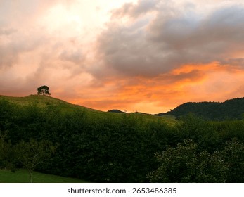 Dramatic Storm Clouds at Sunset Over Rolling Hills and Countryside