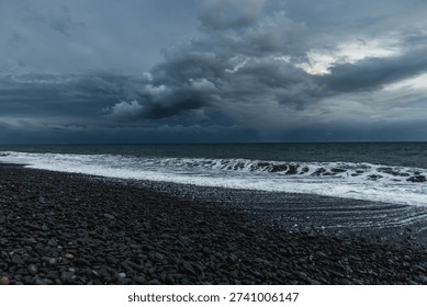 Dramatic Storm Over Madeira Ocean Shoreline With Dark Clouds, Rolling Waves And Moody Blue Lighting. 